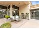 Cozy covered patio with comfortable seating, potted plants and natural lighting at 7705 E Doubletree Ranch Rd # 56, Scottsdale, AZ 85258