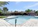 Outdoor pool with clear blue water, surrounded by chairs and umbrellas, perfect for relaxation and recreation at 7705 E Doubletree Ranch Rd # 56, Scottsdale, AZ 85258