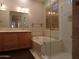 Luxurious bathroom with double vanity, soaking tub, and walk-in shower at 7741 E Balao Dr, Scottsdale, AZ 85266