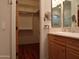 Bathroom with double vanity and access to walk-in closet at 7741 E Balao Dr, Scottsdale, AZ 85266