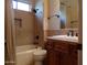 Clean bathroom with tile shower/tub combo and wood vanity at 7741 E Balao Dr, Scottsdale, AZ 85266