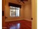 Bright bedroom with hardwood floors and large window at 7741 E Balao Dr, Scottsdale, AZ 85266