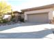 Single-story home with desert landscaping and two-car garage at 7741 E Balao Dr, Scottsdale, AZ 85266