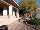 Landscaped front yard with desert plants and stone pathway at 7741 E Balao Dr, Scottsdale, AZ 85266