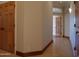 Elegant hallway with hardwood floors and access to bedrooms and bathroom at 7741 E Balao Dr, Scottsdale, AZ 85266