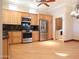 Kitchen with stainless steel appliances and light wood cabinets at 7741 E Balao Dr, Scottsdale, AZ 85266