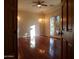 Bright living room with hardwood floors, chandelier, and access to backyard at 7741 E Balao Dr, Scottsdale, AZ 85266