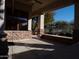 Covered patio with stonework, desert landscape, and mountain views at 7741 E Balao Dr, Scottsdale, AZ 85266