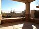 Covered patio with stonework, desert landscape, and mountain views at 7741 E Balao Dr, Scottsdale, AZ 85266