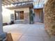 Covered patio with stone wall and pergola at 7741 E Balao Dr, Scottsdale, AZ 85266