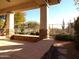 Covered patio with stonework, desert landscape, and mountain views at 7741 E Balao Dr, Scottsdale, AZ 85266