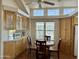 Kitchen nook featuring natural wood cabinetry, round breakfast table, and natural lighting at 7750 E Broadway Rd # 400, Mesa, AZ 85208