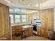 Well-lit kitchen featuring wood cabinets, an island, bright countertops and modern appliances at 7750 E Broadway Rd # 400, Mesa, AZ 85208