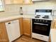 Kitchen area featuring wood cabinets, bright countertops and modern appliances at 7750 E Broadway Rd # 400, Mesa, AZ 85208