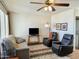 Cozy living room features neutral seating and a ceiling fan for added comfort at 7750 E Broadway Rd # 400, Mesa, AZ 85208