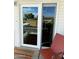 Welcoming patio with a chair, striped rug, and sunlit patio door at 7750 E Broadway Rd # 400, Mesa, AZ 85208