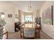 Bright dining room with a large window and wood table at 7928 E Pueblo Ave # 62, Mesa, AZ 85208