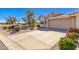 Tan stucco home with a two-car garage and desert landscaping at 7928 E Pueblo Ave # 62, Mesa, AZ 85208