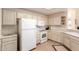 Kitchen with white appliances and light wood cabinets at 7928 E Pueblo Ave # 62, Mesa, AZ 85208