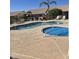 Community pool and spa with lounge chairs at 7928 E Pueblo Ave # 62, Mesa, AZ 85208