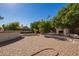 Large backyard patio with fireplace and seating at 8501 W Glenrosa Ave, Phoenix, AZ 85037