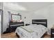 Bedroom with a gray and white comforter and a black dresser at 8501 W Glenrosa Ave, Phoenix, AZ 85037