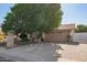 House exterior with driveway and mature landscaping at 8501 W Glenrosa Ave, Phoenix, AZ 85037