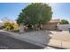 House exterior with driveway and mature landscaping at 8501 W Glenrosa Ave, Phoenix, AZ 85037