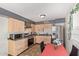 Bright kitchen with light wood cabinets, stainless steel appliances, and a small dining area at 8501 W Glenrosa Ave, Phoenix, AZ 85037