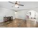 Living room with tile floors and an archway to dining area at 8501 W Glenrosa Ave, Phoenix, AZ 85037