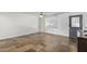 Living room with tile floors, ceiling fan, and gray door at 8501 W Glenrosa Ave, Phoenix, AZ 85037