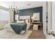 Well-lit main bedroom with a geometric accent wall and a cozy area rug at 8517 W Mantle Way, Florence, AZ 85132