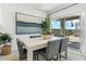 Cozy dining room with a view to the backyard through the sliding glass door at 8517 W Mantle Way, Florence, AZ 85132