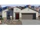 Charming single-story home featuring a two-car garage, neutral paint, and mountain views at 8517 W Mantle Way, Florence, AZ 85132