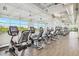 Well-equipped gym featuring cardio machines and floor-to-ceiling windows at 8517 W Mantle Way, Florence, AZ 85132