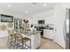 Beautiful kitchen with a granite countertop island, stainless steel appliances, and white cabinets at 8517 W Mantle Way, Florence, AZ 85132