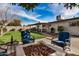 Relaxing backyard patio with fire pit and putting green at 8620 E Starlight Way, Scottsdale, AZ 85250