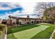 Large backyard with putting green and patio at 8620 E Starlight Way, Scottsdale, AZ 85250