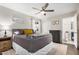 Well-lit bedroom with a queen bed and ceiling fan at 8620 E Starlight Way, Scottsdale, AZ 85250