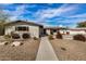 Charming single story home with landscaped front yard and walkway at 8620 E Starlight Way, Scottsdale, AZ 85250