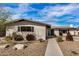 Charming single story home with landscaped front yard and walkway at 8620 E Starlight Way, Scottsdale, AZ 85250