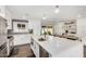 Modern kitchen featuring white cabinets and a large island at 8620 E Starlight Way, Scottsdale, AZ 85250