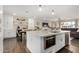 Modern kitchen with white cabinets, built-in microwave, and breakfast bar at 8620 E Starlight Way, Scottsdale, AZ 85250