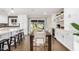 Bright kitchen with white cabinets, island, and dining area at 8620 E Starlight Way, Scottsdale, AZ 85250