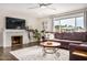 Living room features hardwood floors, fireplace, and ample natural light at 8620 E Starlight Way, Scottsdale, AZ 85250