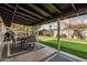 Covered patio with seating area and putting green at 8620 E Starlight Way, Scottsdale, AZ 85250