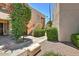 Landscaped walkway leading to condo building entrance at 9275 E Mission Ln # 207, Scottsdale, AZ 85258