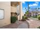 Exterior view of condo building with walkway and landscaping at 9275 E Mission Ln # 207, Scottsdale, AZ 85258