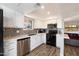 Updated kitchen with white cabinets and mosaic backsplash at 9275 E Mission Ln # 207, Scottsdale, AZ 85258