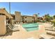 Inviting community pool surrounded by comfortable lounge chairs at 9275 E Mission Ln # 207, Scottsdale, AZ 85258